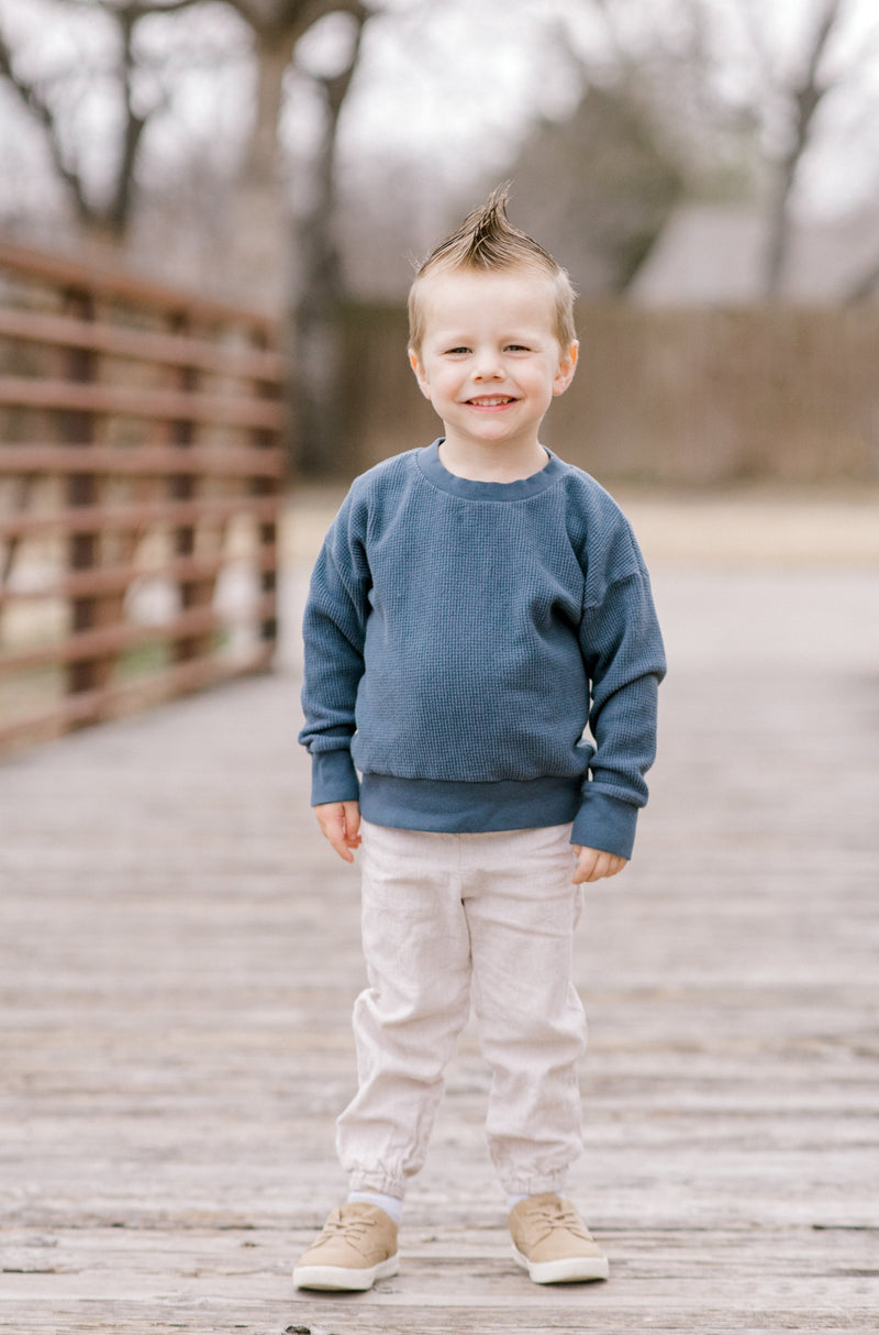 boy standing posing in blue fashion jeans and modern army sweats Stock  Photo | Adobe Stock